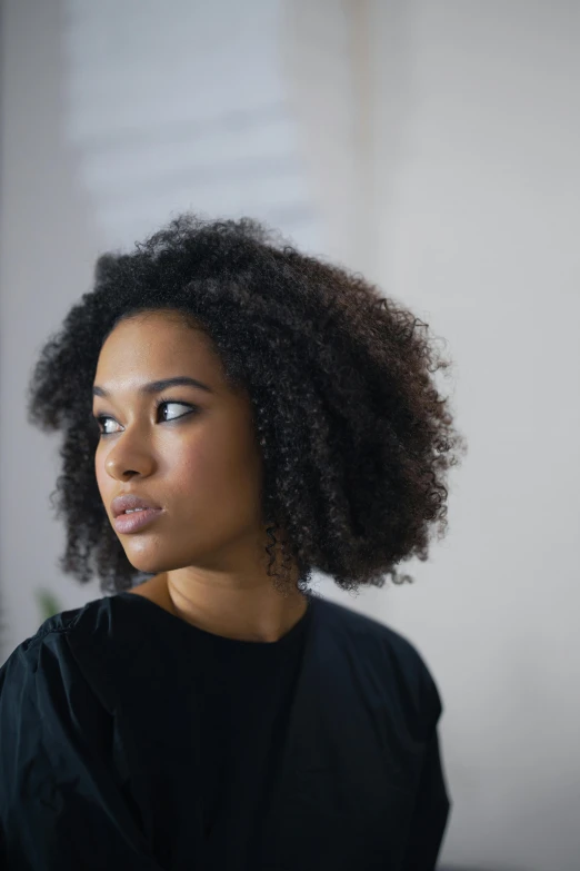 an african american girl with dark brown hair