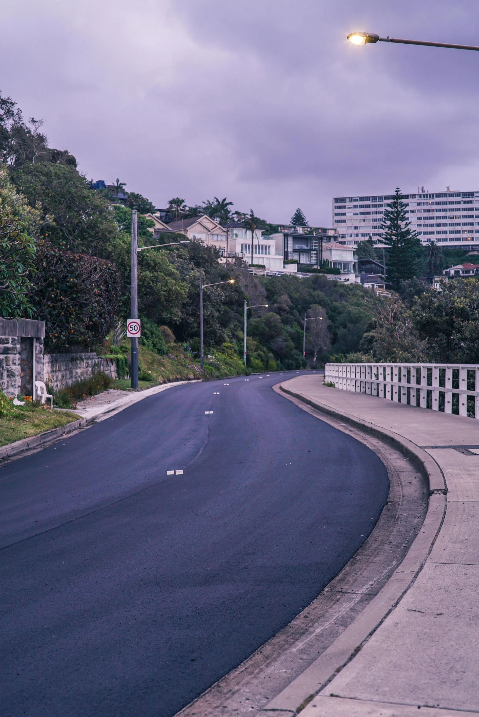 the street lights glow on a very quiet road