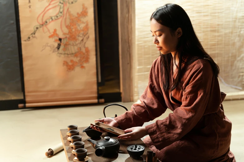 a woman playing a game of chinese chess on top of a wooden table