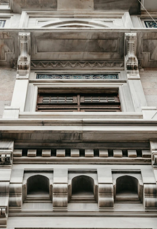 a picture of a tall building with windows and a door