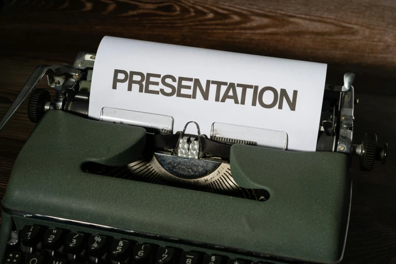 a paper that reads presentation on it next to an old typewriter