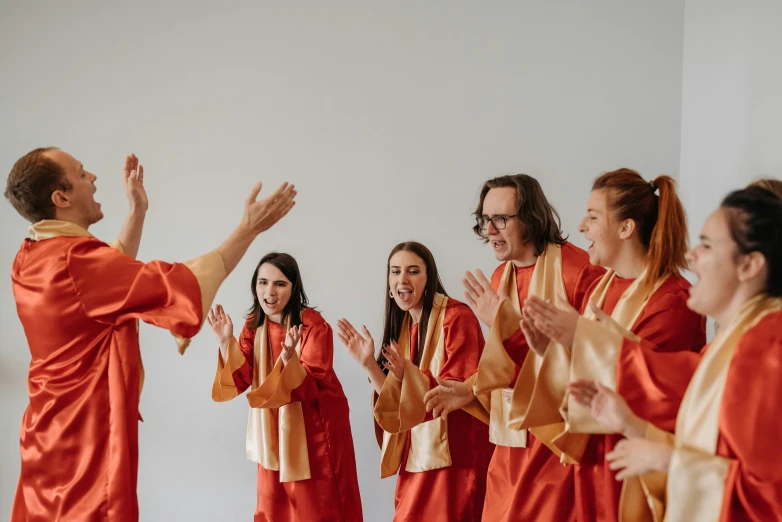 a group of people who are wearing orange clothing