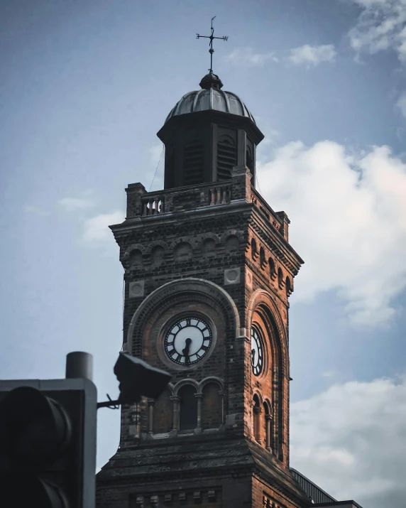 a large clock tower against a blue sky