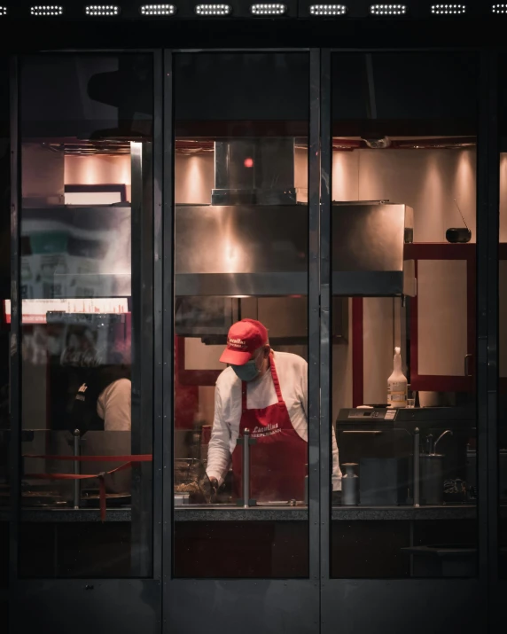 a person working on soing in a kitchen