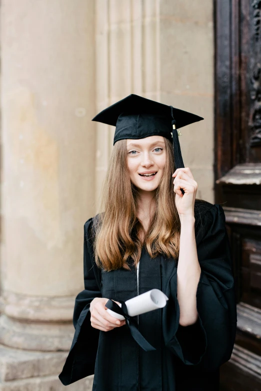 young woman in her graduation cap and gown