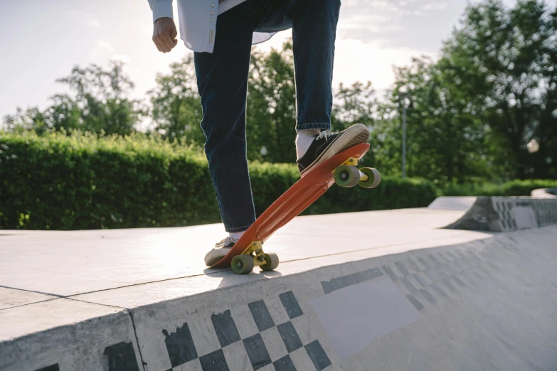 person with one foot on a skate board