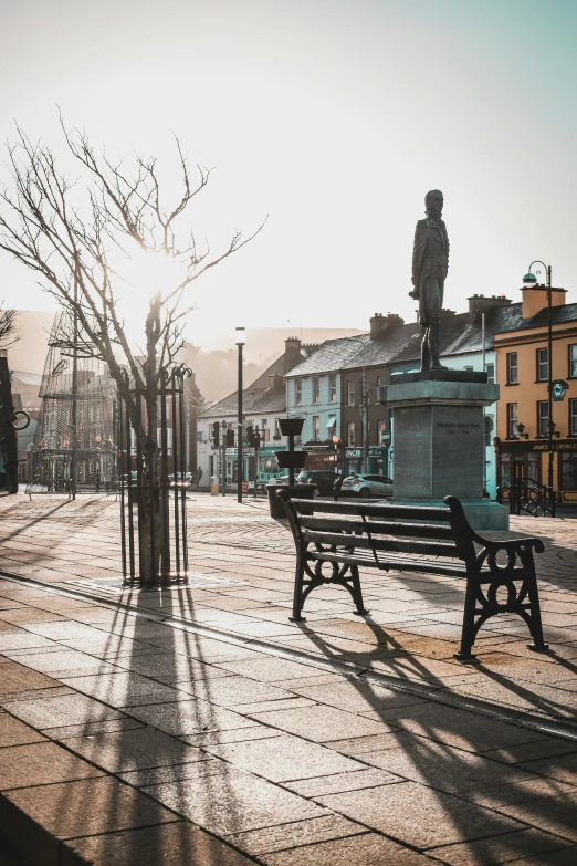 the empty park bench is overlooking a barren street