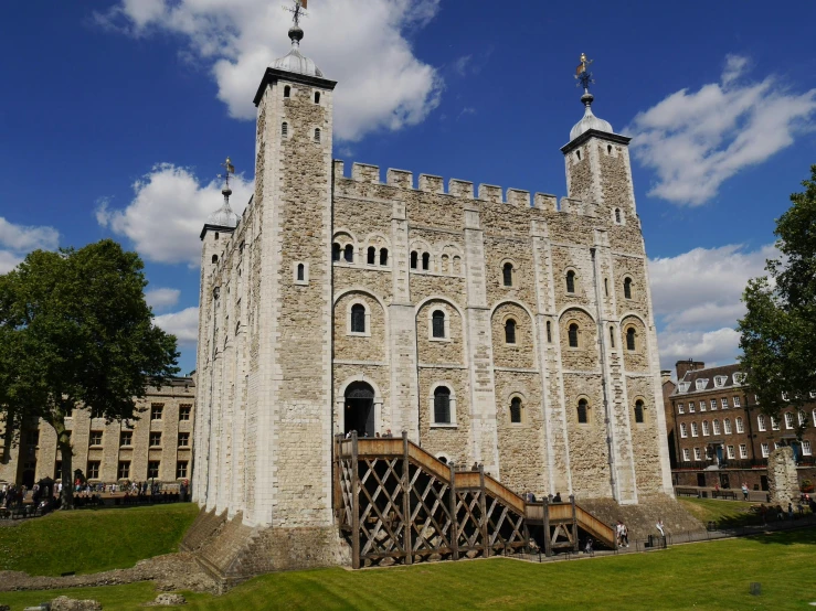 a tall stone building with a staircase leading to the top