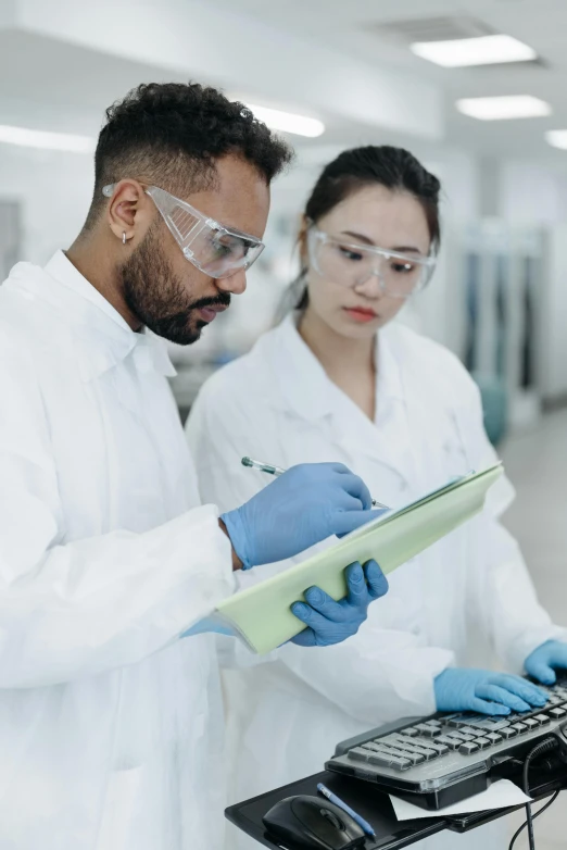 two people in a lab doing soing