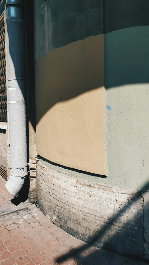 shadows over the wall of a building in a city