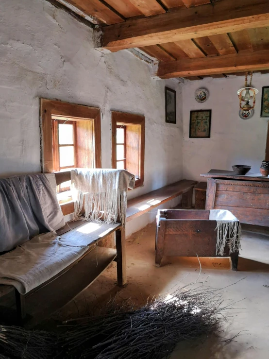 an old fashioned room with a rustic looking couch