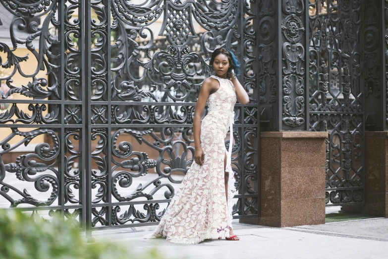 a young woman is standing outside in a floral dress