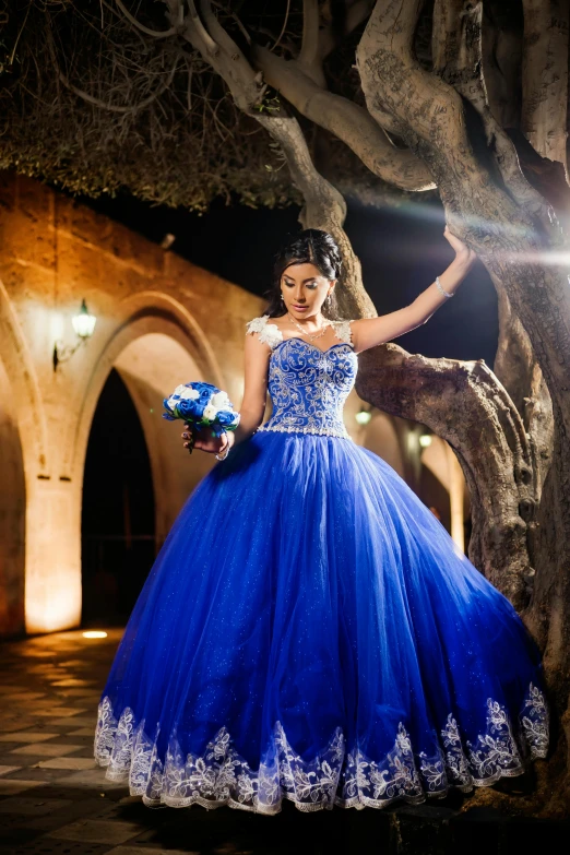 a beautiful woman wearing blue and white dress