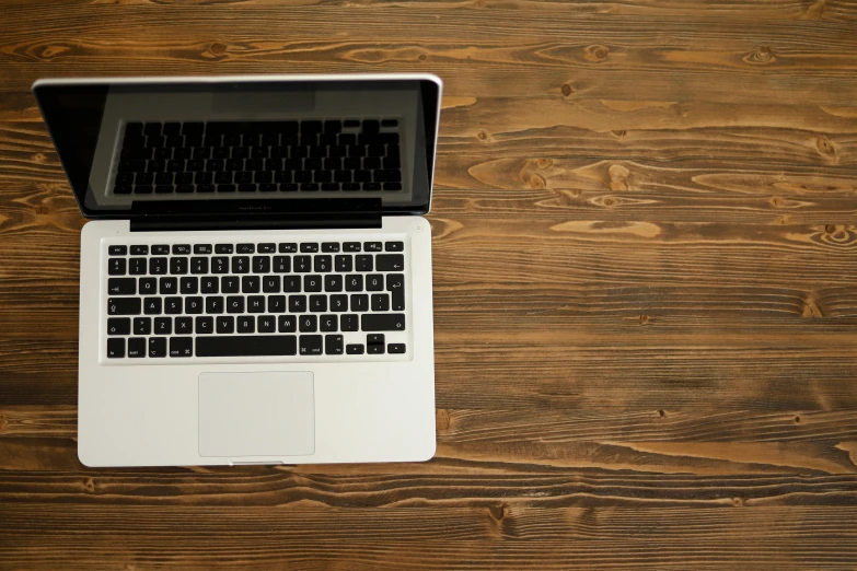 an overhead view of a laptop on the table