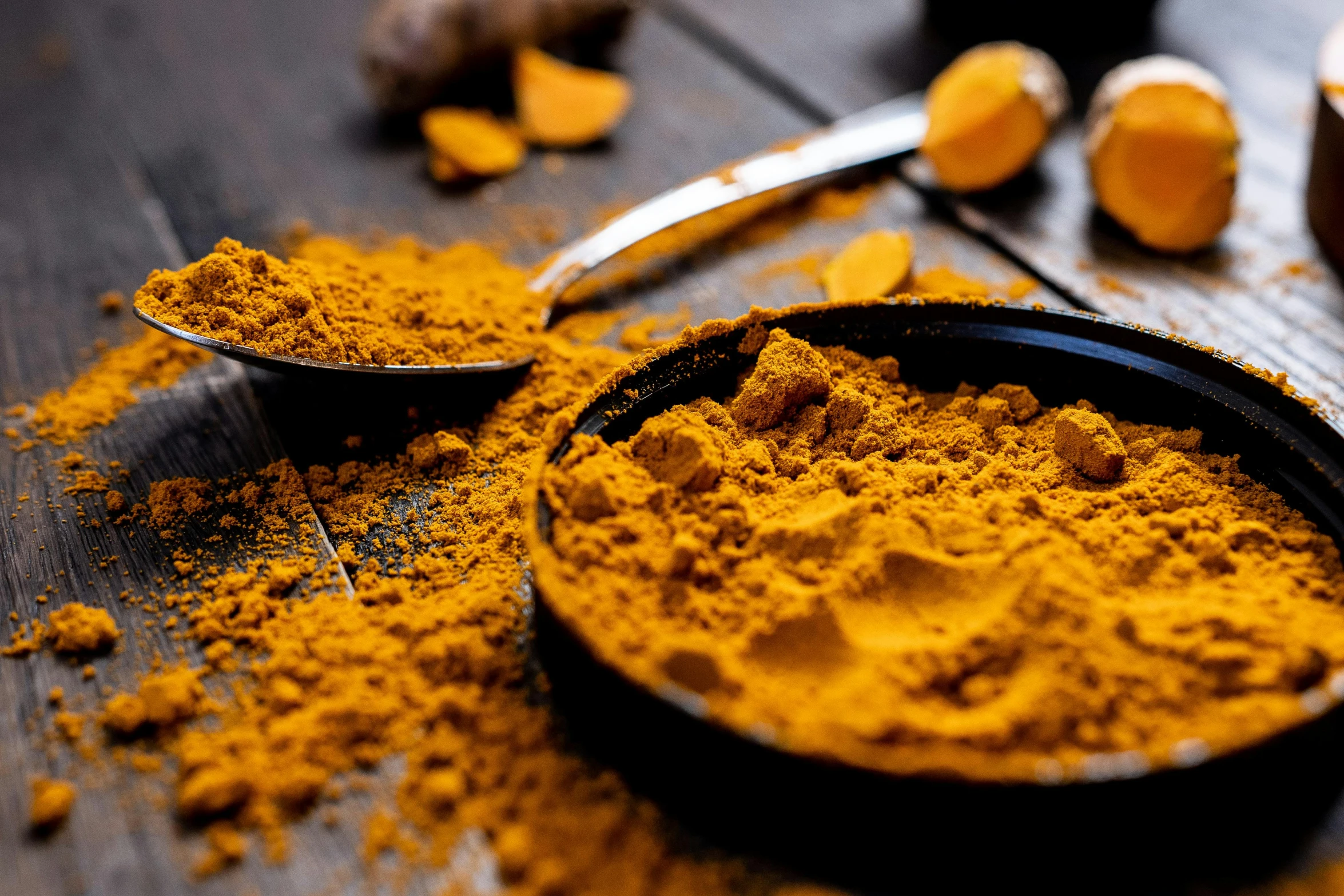 spices, nuts and measuring spoons on a table