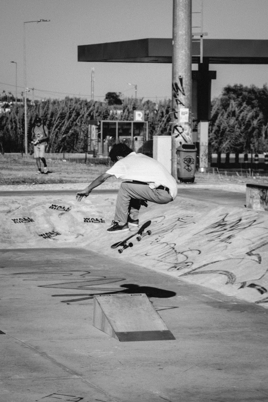 a man riding a skateboard down the side of a cement ramp