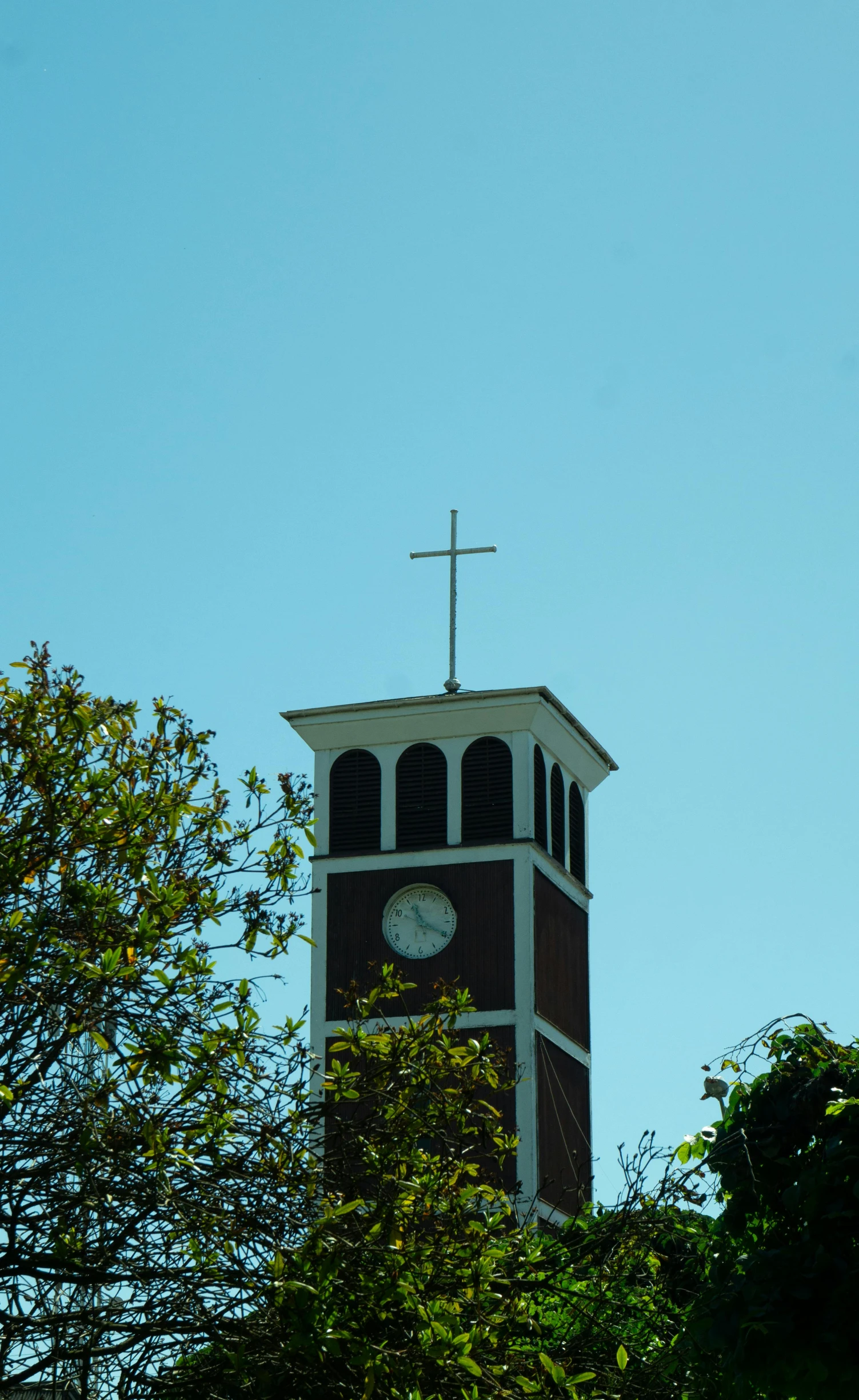 the clock tower looks to have a cross on top