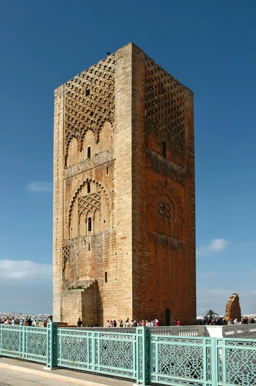 tall brick tower with ornate carvings on top