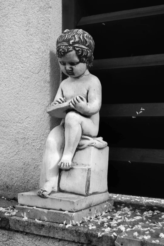 an old statue is outside by the door