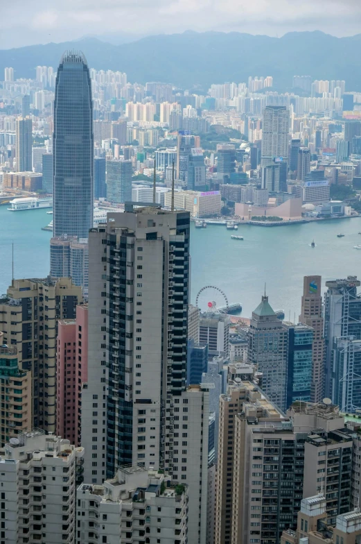 a city skyline, with some tall buildings and water