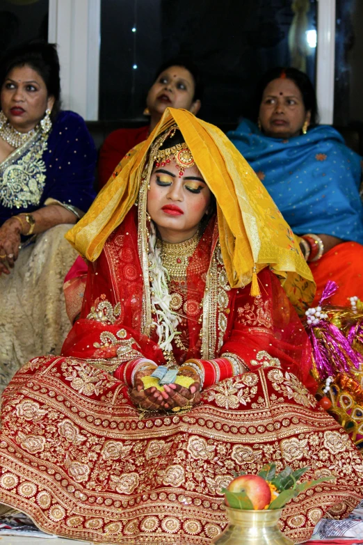 an image of an indian bride in red