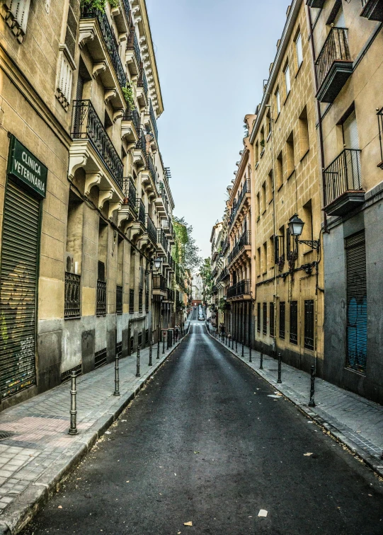 an empty street and a tall brick building