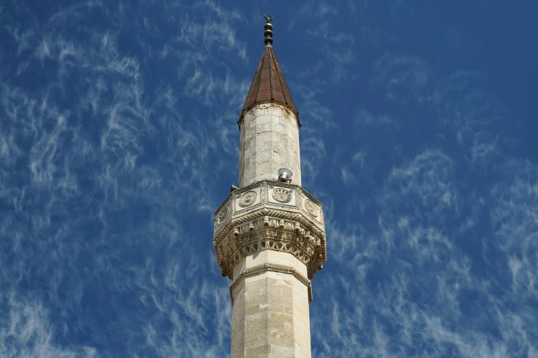 the top of a tall building with a sky background