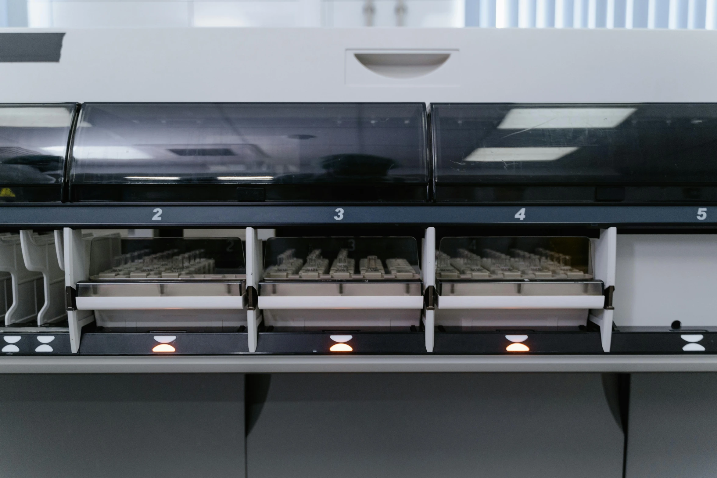 two rows of ovens filled with food in the middle of a kitchen