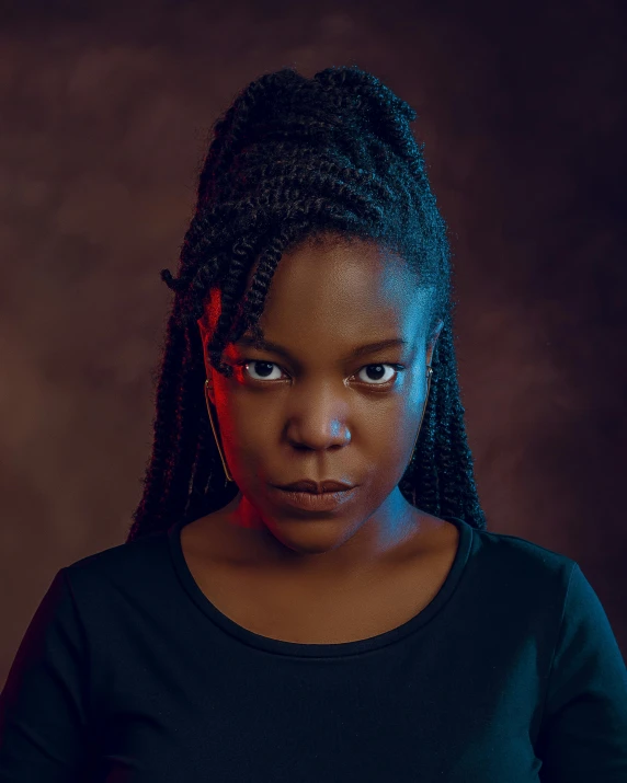 woman with dreadlocks and neon light