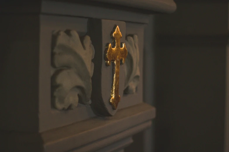 an image of a cross that is placed inside a building