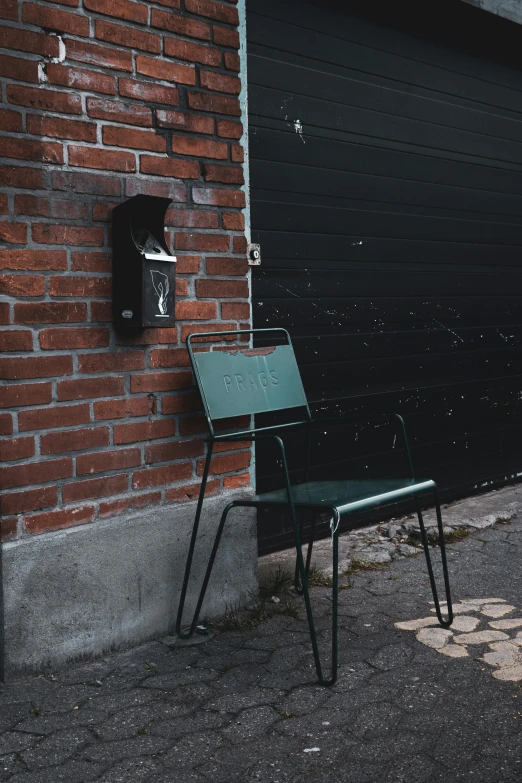 a chair that is sitting in front of a building