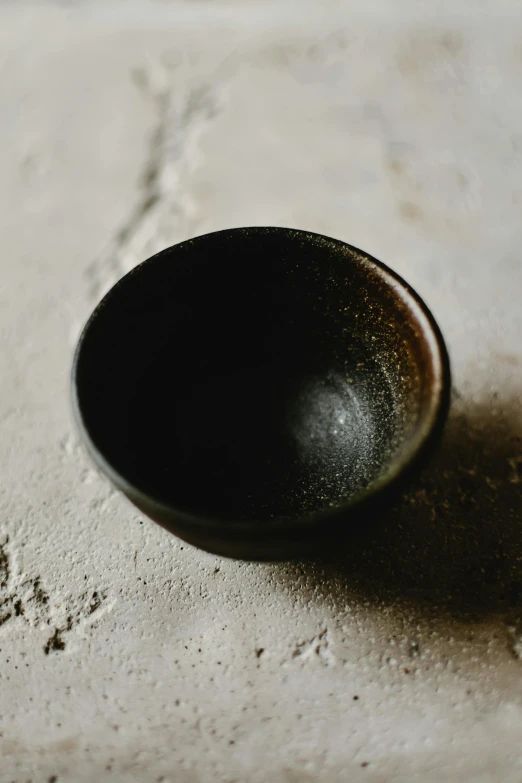 a black bowl that has soing in it