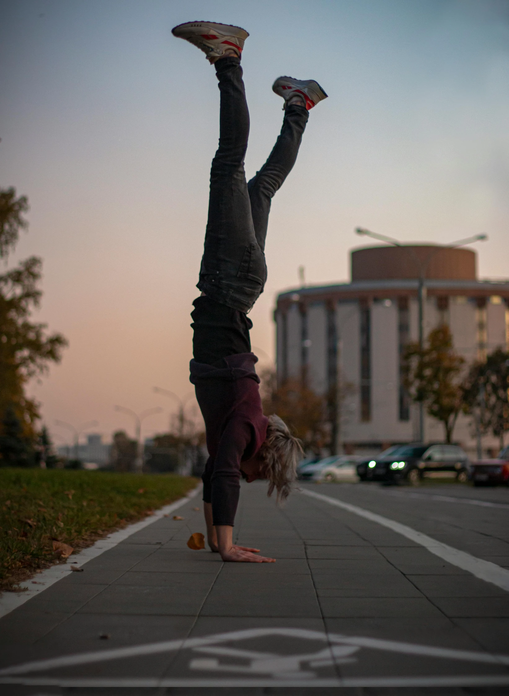 a man standing on his back with a pair of shoes on