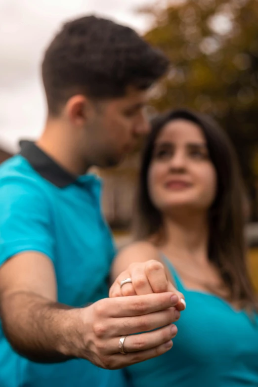 man and woman leaning against each other as they touch each other