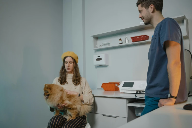 a man and a woman in the kitchen next to a counter