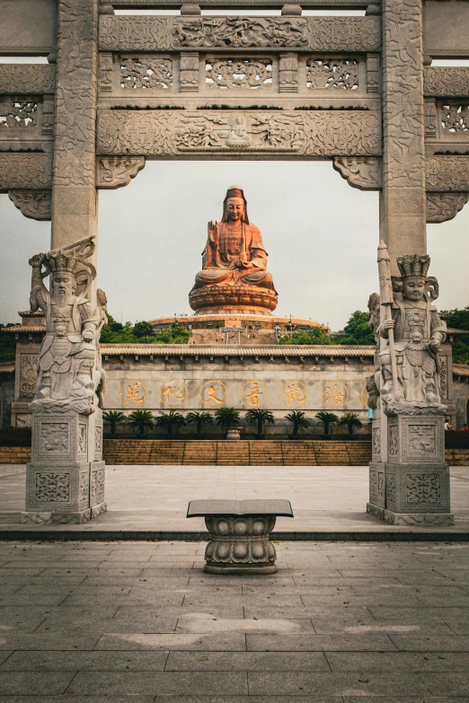 a small sitting bench with the temple in the background