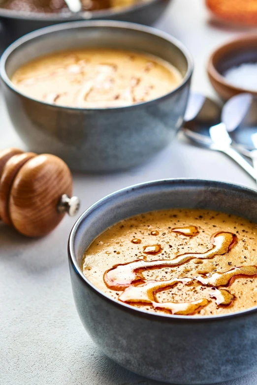 two large metal bowls with food in them