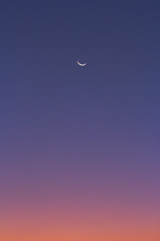 moon and half way up in the evening sky