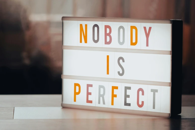 a lightbox that says nobody is perfect on it