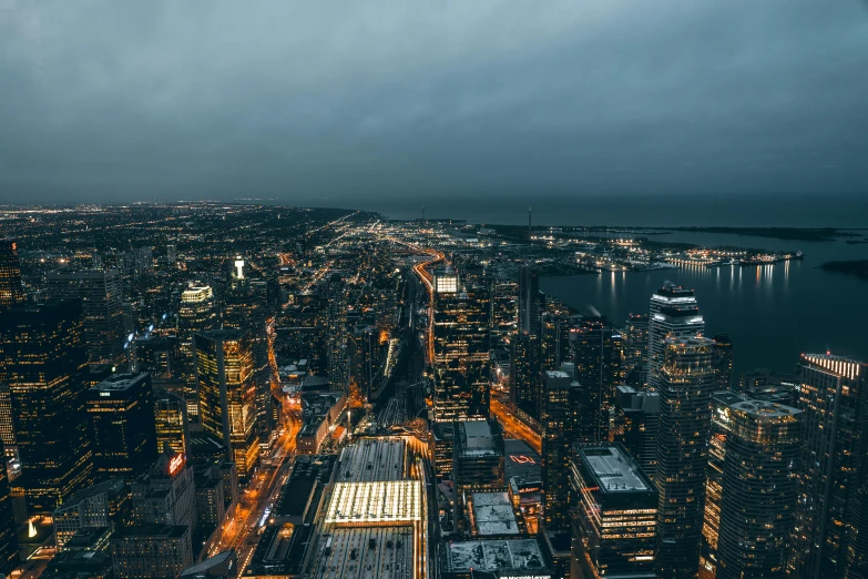 a large city skyline under a cloudy sky