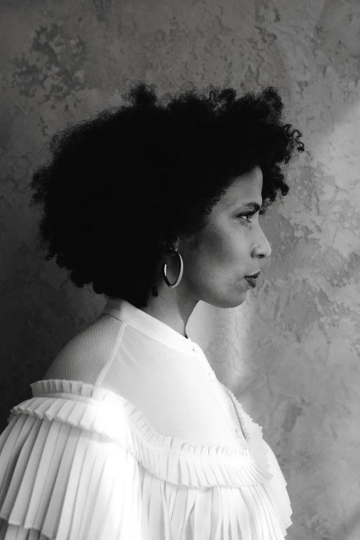 black and white portrait of a woman wearing an off shoulder shirt