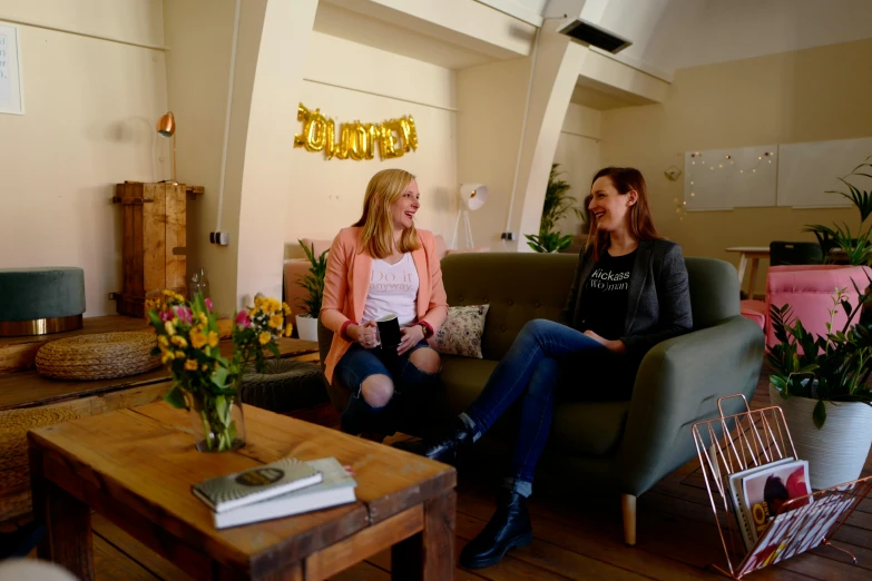 two women talking in a small room