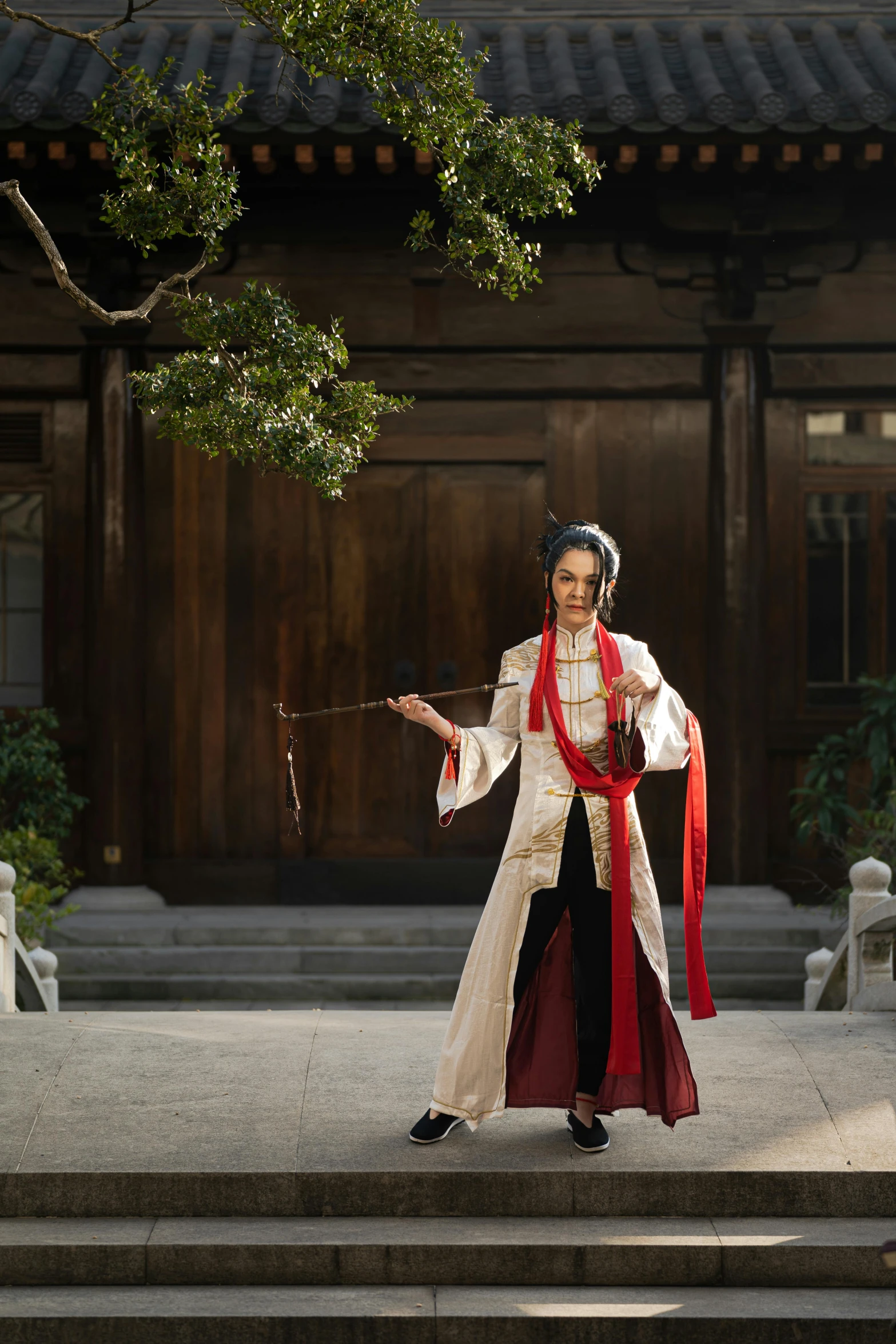 an asian woman wearing a long white robe