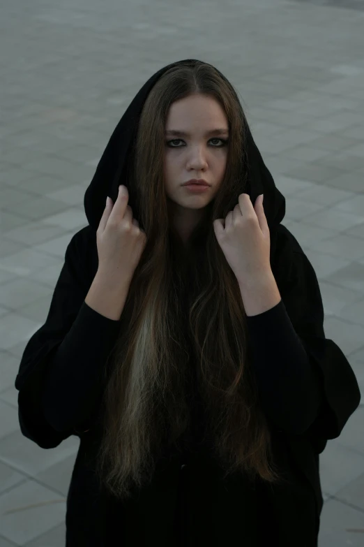 a woman with long hair covering her face