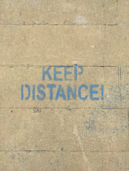 a close up of a sidewalk with a blue message