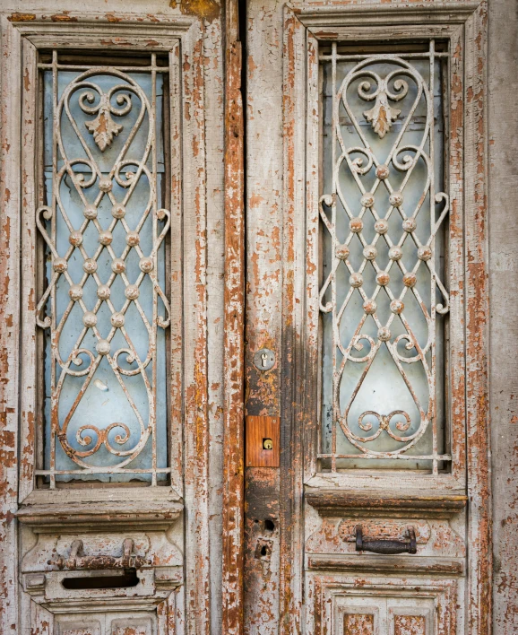 two dirty doors side by side on each other