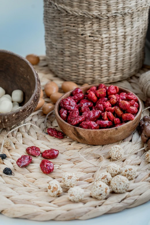 berries and marshmallows on a woven rug with two bowls