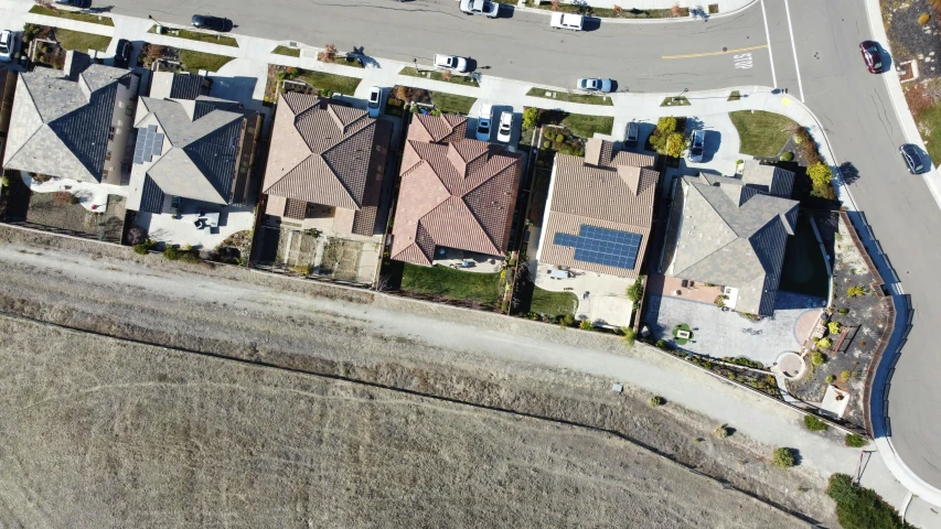 a residential area with a lot and several cars parked