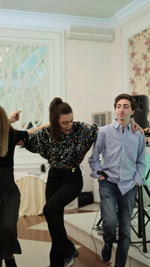 a young man is performing an energetic salsa with his friends