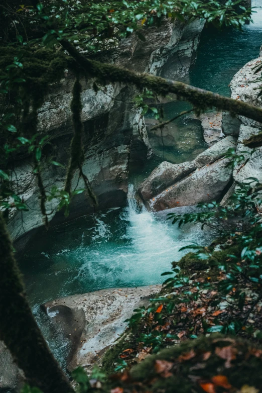 a stream of water flowing between two large rocks